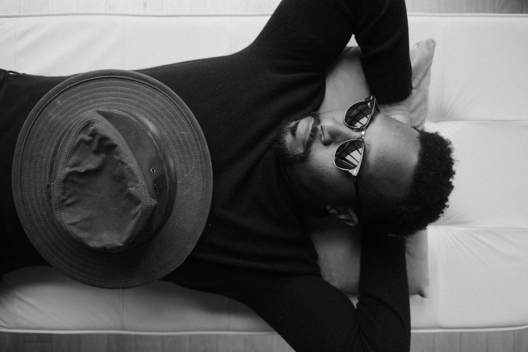 At rest, hat on the chest